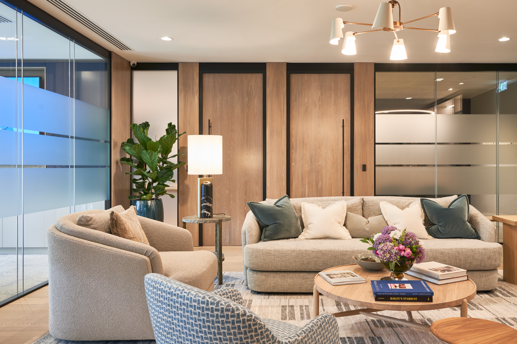 A sophisticated meeting room at Asset Management Firm, complete with wood finishes and contemporary design elements by Modus Workspace.