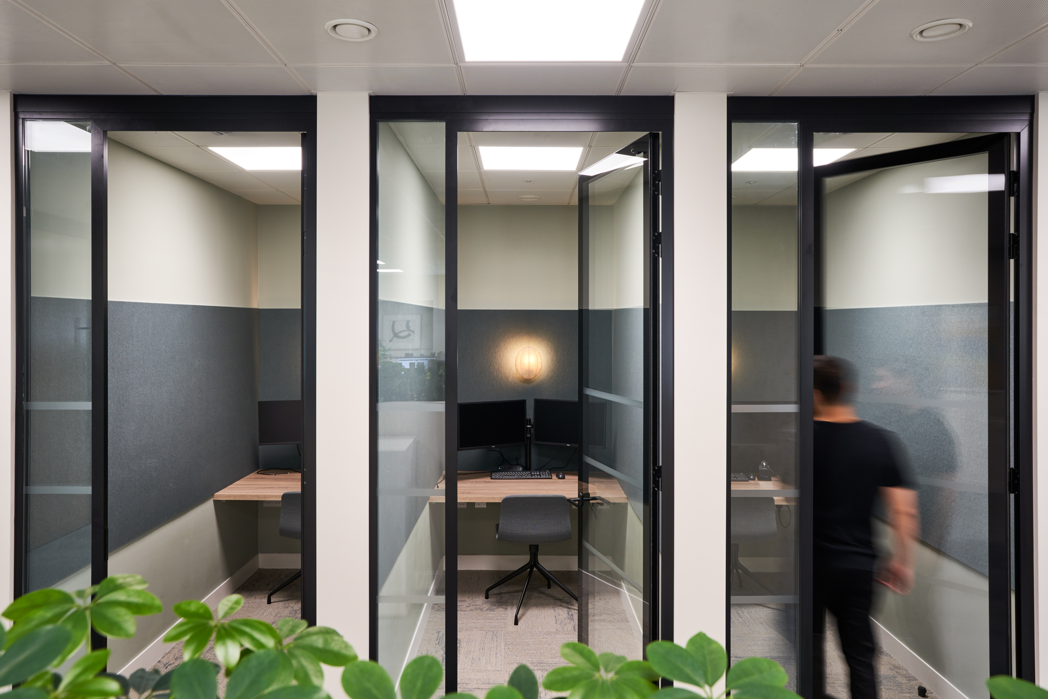 Sleek and comfortable focus pods for individual work at Asset Management Firm, designed by Modus Workspace for productivity and privacy.