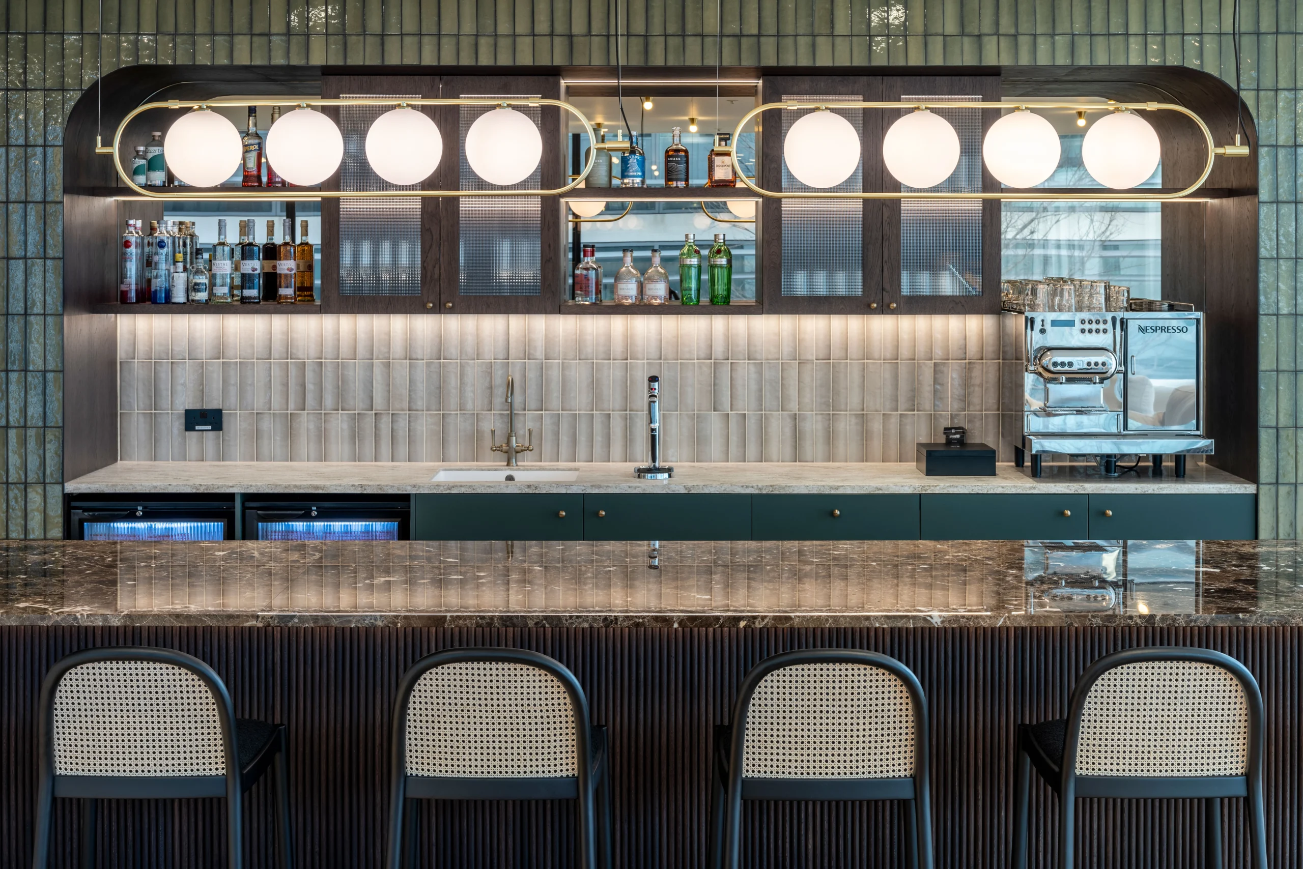 A seating corner at Authentic Brand Group, designed by Modus, with plush furniture and soft lighting, separated by a translucent curtain to create a semi-private atmosphere.