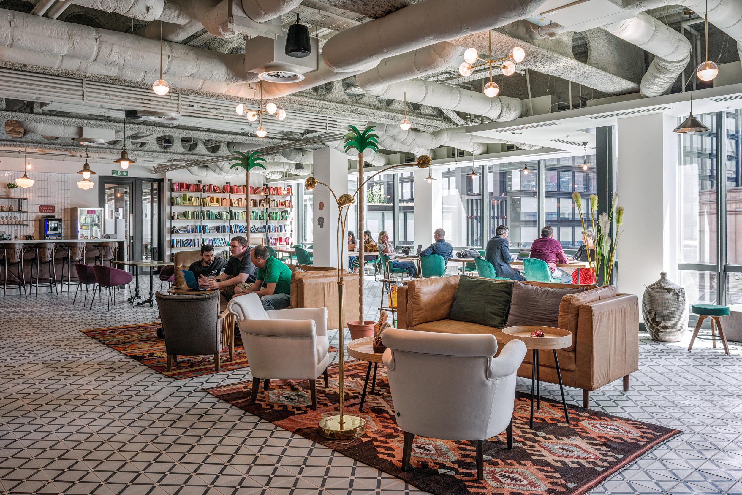 Mindspace Appold Street's open lounge area with colourful seating and bookshelves.